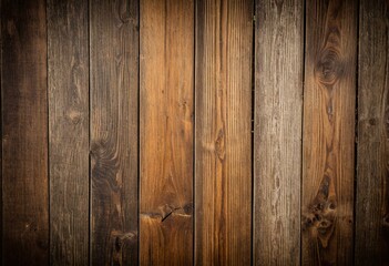 A close up of a wooden wall with a dark background.