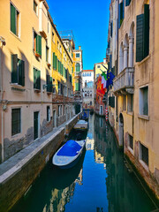 Canal wth boats in Venice Italy