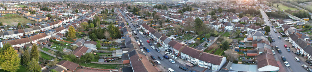 Fototapeta premium Ultra Wide Angle Panoramic View of Residential District of Northern Luton City of England UK During Eid Day. The Aerial Footage Was Captured with Drone's Camera During Cloudy Day of March 31th, 2025