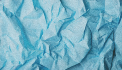 Obraz premium Crumpled light blue wrapping paper presenting textured, grainy surface with intricate folds and wrinkled abstract background