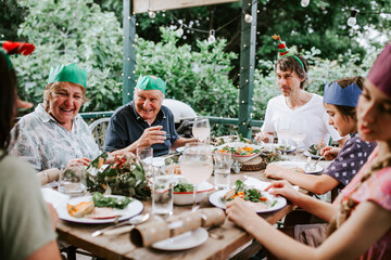 Happy multigeneration family enjoying Christmas dinner