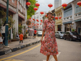 Young woman in ethnic dress and hat exploring the festive streets of George Town, Malaysia, during Chinese New Year. Vibrant lanterns, cultural celebrations, and historic charm create a unique atmosph