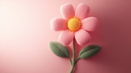 Obraz premium A pink flower with textured petals and a yellow center, set against a soft pink background, creating a charming and whimsical aesthetic.