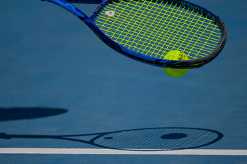 Tennis Racket with ball on Court