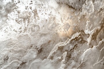 Intricate patterns of ice and frost on a glass surface creating a cold, wintery texture
