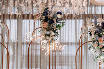 A vibrant floral arrangement featuring white and pink roses, gerberas, hydrangeas, and gypsophila...