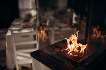 Modern indoor ethanol fireplace with warm flames