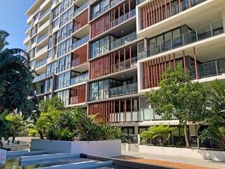 Modern apartment block with courtyard in foreground