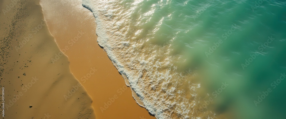 Poster serene aerial view of turquoise ocean waves lapping against a golden sandy beach, creating a peacefu