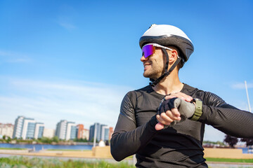 Cyclist Prepares for Adventure Against a Vibrant Skyline on a Bright Sunny Day