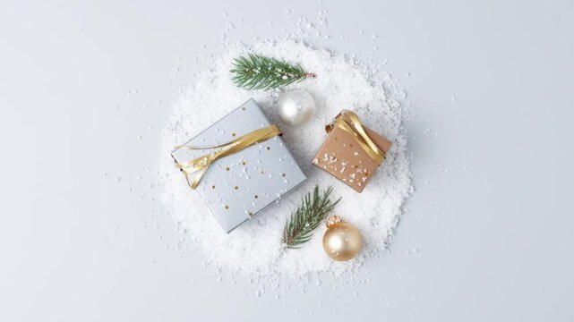 Christmas decorations with packaging gifts and Christmas tree  on grey background. Flat lay, copy space