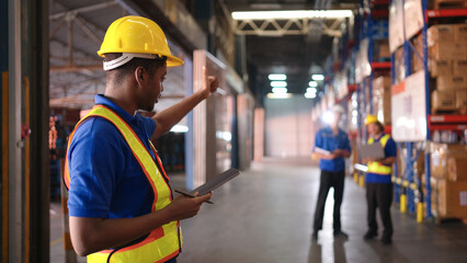 Portrait of warehouse workers are reviewing the list of items based on the documentation