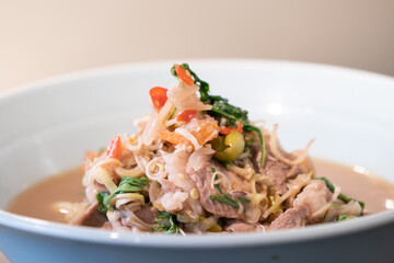 Thai Food, boiled with fried Pork cooked with Shrimp Paste in white bowl that ready to serve and eat.