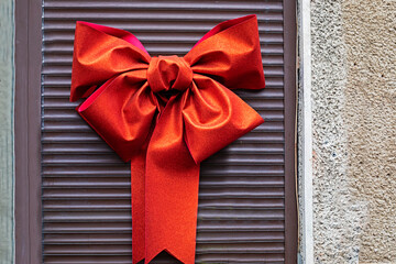 red bow on door roller blinds decoration outside. Traveling around Europe