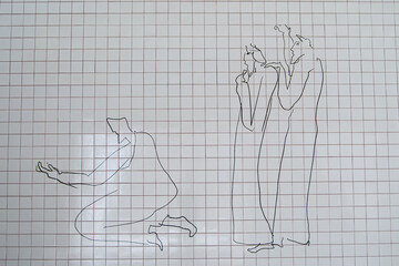 Artistic wall installation with linear human designs in Fatima, Portugal.  Biblical scene.
