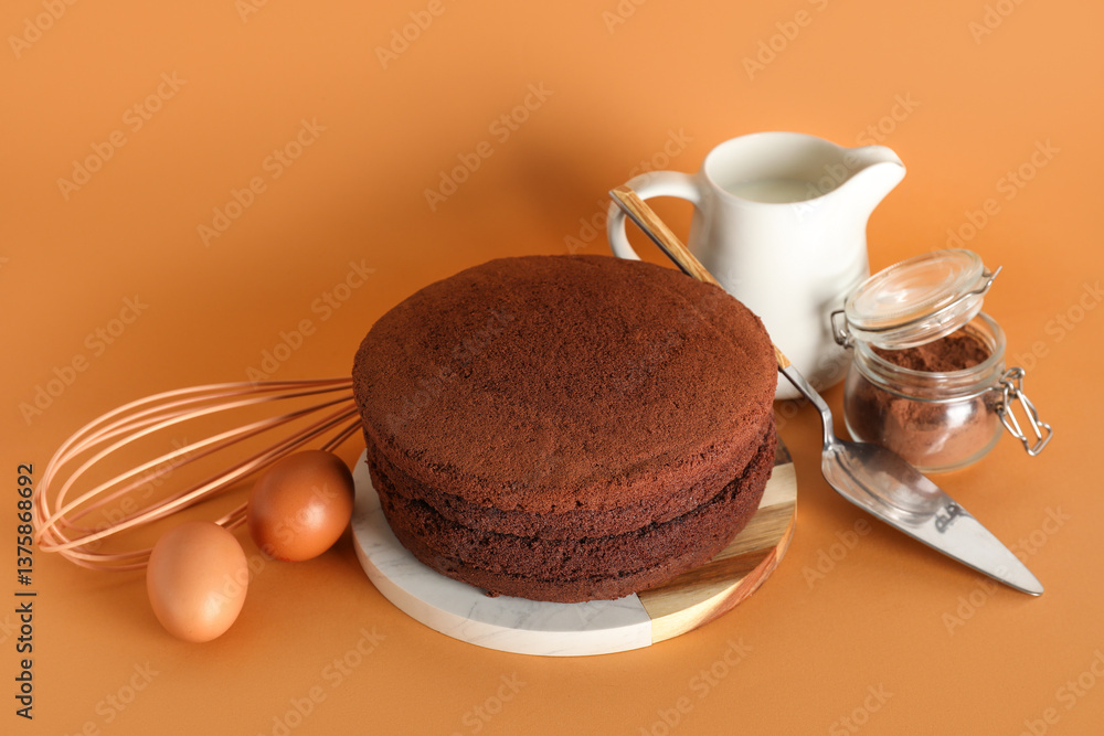 Wall mural board with sponge cake layers, ingredients and utensils on color background