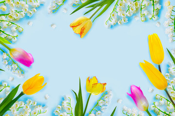 Festive natural composition of spring flowers lilies of the valley and tulips.