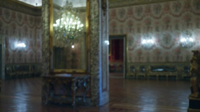 Luxurious blurry interior of galleria doria pamphilj showcasing elegant chandelier, ornate decor, bokeh lighting, classic european museum ambiance, rich cultural heritage, and historic art display.