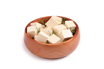 Bowl with pieces of tasty tofu cheese isolated on white background