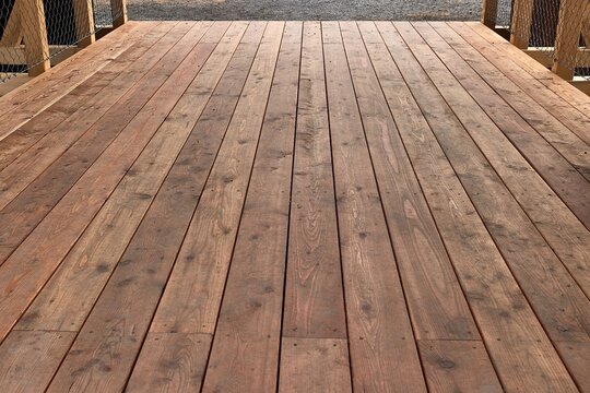 Wood deck lumber bridge