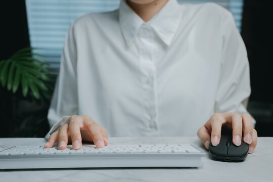Focused person working on keyboard and mouse, Business concept - Powered by Adobe