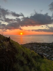 Beautiful view overlooking a town, sunset, and ocean. 