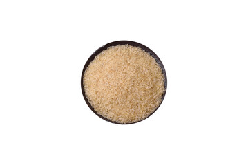 White raw rice in a ceramic bowl. Rice as an ingredient