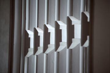 Textured White Wooden Panels with Light Shadow Play in Interior