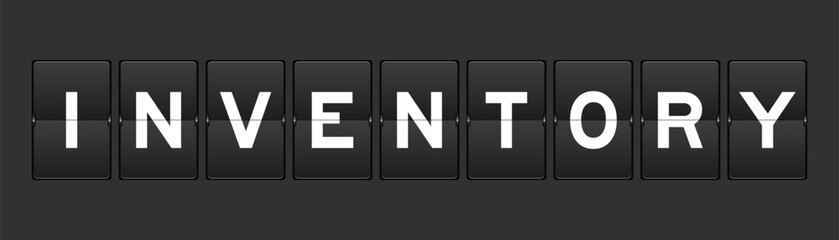 Black color analog flip board with word inventory on gray background
