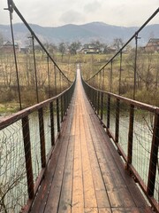 Obraz premium wooden bridge over the river