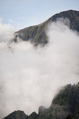 Big white clouds in the valley between two mountain peaks, High Tatra mountains, Slovakia