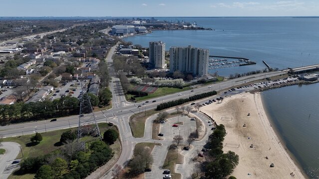 Newport News, VA coastline living by James river landscape with city streets public parks resort hotels and neighborhoods on warm sunny day in Virginia