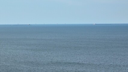 Chesapeake Bay at Virginia Beach, VA showing bridge and tunnel on horizon on a clam peaceful day...
