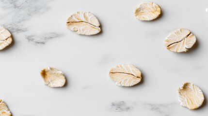 Fototapeta premium Unique dried melon slices arranged on a marble countertop for aesthetic presentation