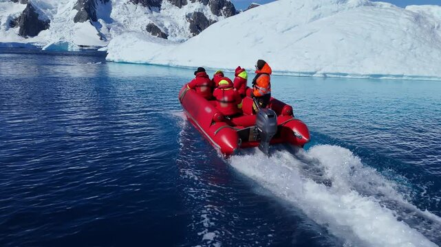 Antarctica icy landscape expedition group tourist traveler people man at cruise red boat ship winter Arctic snow mountains Iceberg glacier nature cold water, Scientist Tourism travel. Aerial drone 