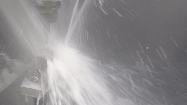 The 5-axis CNC milling machine cutting the impeller part with liquid coolant method.