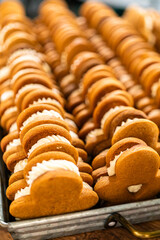 Making Festive Gingerbread Sandwiches on Rustic Wooden Table