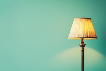 A classical lamp casting a warm glow against a blue wall