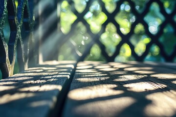 Sunlight streams through a lattice, casting intricate shadows on a weathered wooden surface with greenery visible in the background.