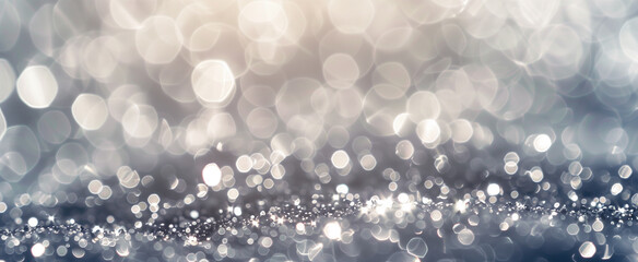 An elegant silver and white bokeh background with a soft and shimmering sparkle.