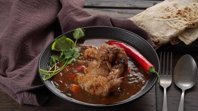 Chakhokhbili traditional Georgian dish is served in steaming bowl