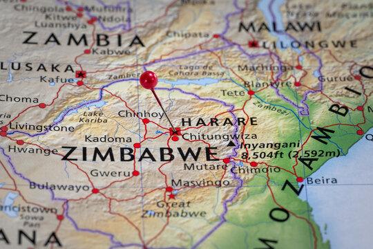 Colorful tourist location map with red stick pin at Harare, Zimbabwe and the surrounding area