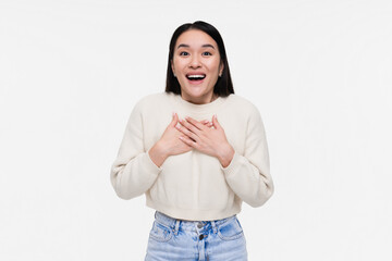 Happy impressed Asian woman girl female student say thank you, holding hands on heart grateful,...