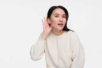 Curious nosy Asian girl woman female student touch ear doing eavesdropping look novelty, try to...
