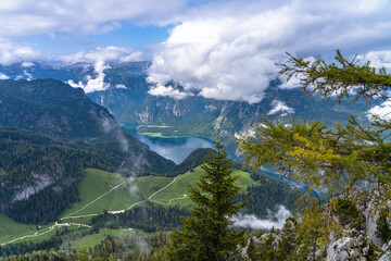 Aerial panorama view of the Koenigssee Lake and the Alps in Berchtesgaden naitional park from top of Jenner peak on a sunny summer day with blue sky and cloud, Bavaria, Germany