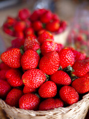 Bunch of Strawberries in bamboo Basket package display for sale at a Farmer's Market, fruit industry, fresh food business, organic product market concept