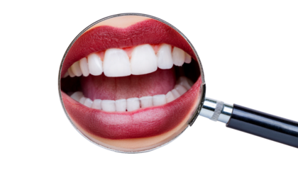 a magnified view of a smiling mouth with perfect white teeth and red lips