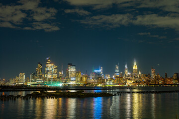 Fototapeta premium New York city. NYC cityscape. Manhattan and WTC in New York Cit. Skyscrapers of Manhattan near rippling water of New York bay. New York skyscrapers. Brooklyn district. NY city.
