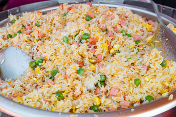 fried rice with corn and green peas and ham and carrots