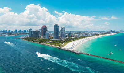 Naklejka premium Top view of South Miami Beach. Scenic drone view of Miamis famous coastline. Miami Beach skyline with skyscrapers. Aerial view of Miami Beach in summer. Miami Beach shore with skyscrapers.